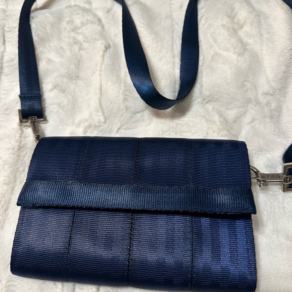 Blue seatbelt small crossbody. Adjustable shoulder strap.
